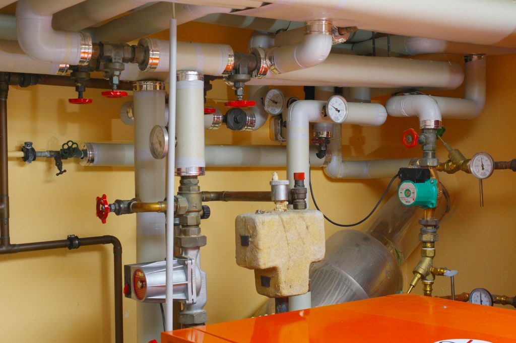 Plant room with pipes, pumps and isolation valves