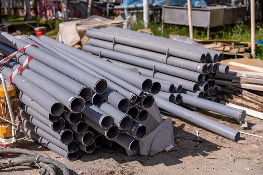 Stack of PVC pipes on a building site ready for installation